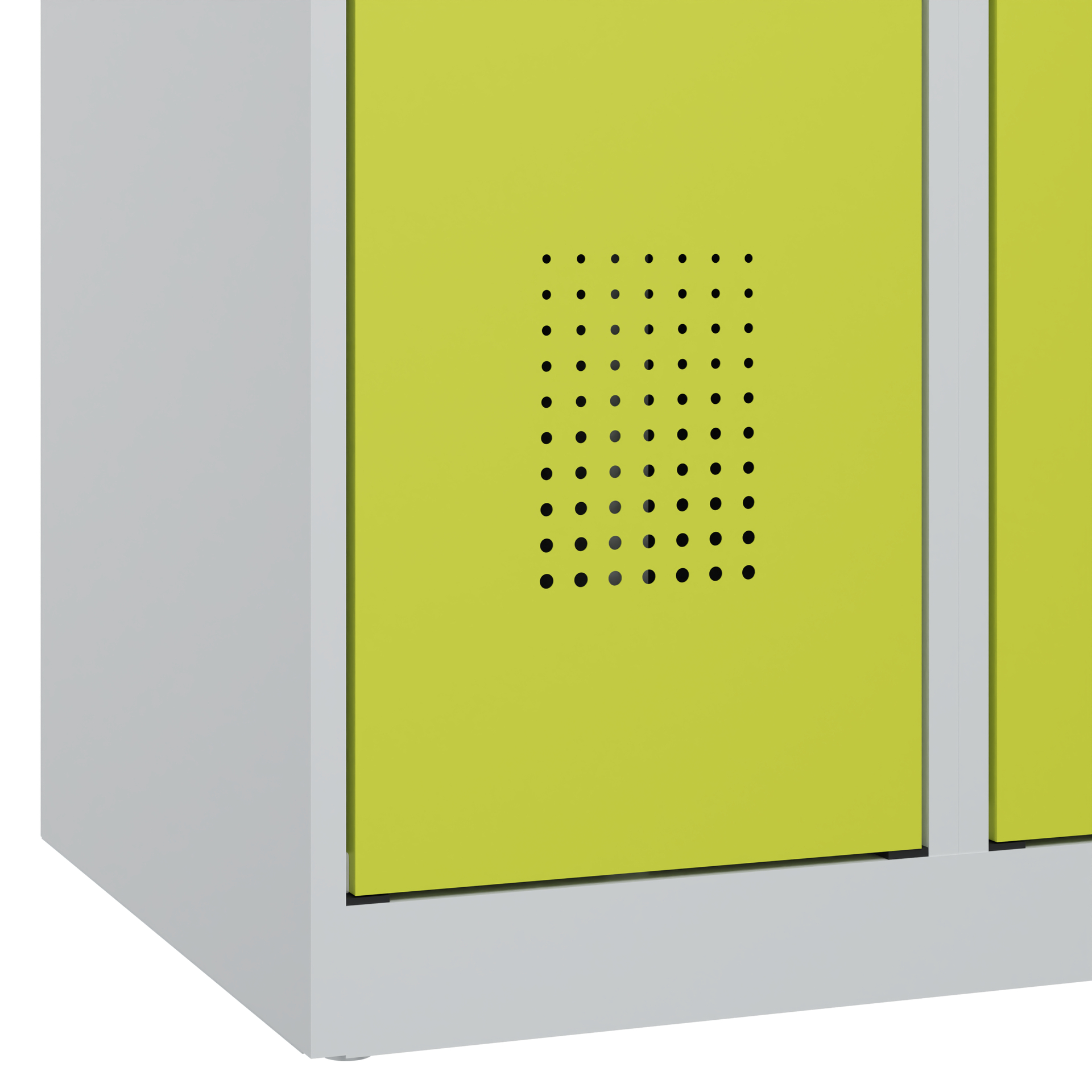 Grüner Metallschrank mit Lüftungslöchern in heller Umgebung.